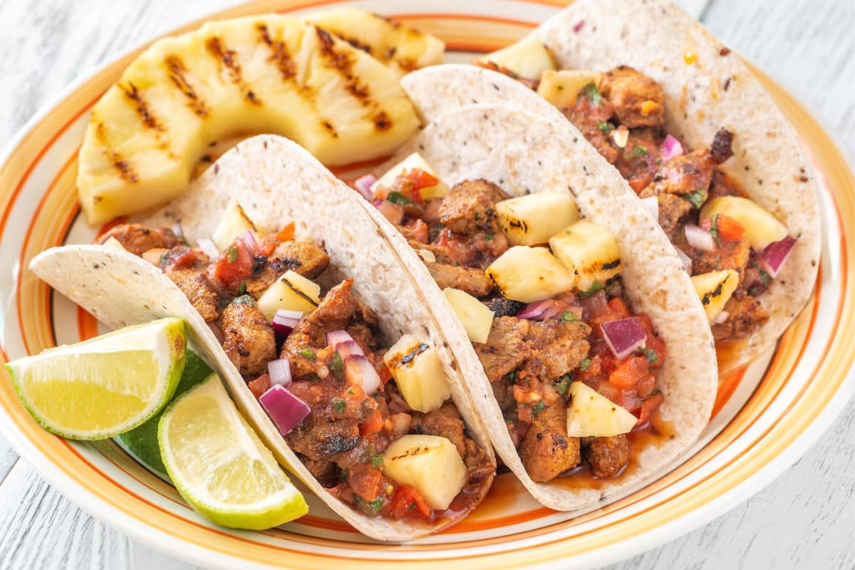 Delicious Chicken Al Pastor Tacos with Grilled Pineapple and Lime